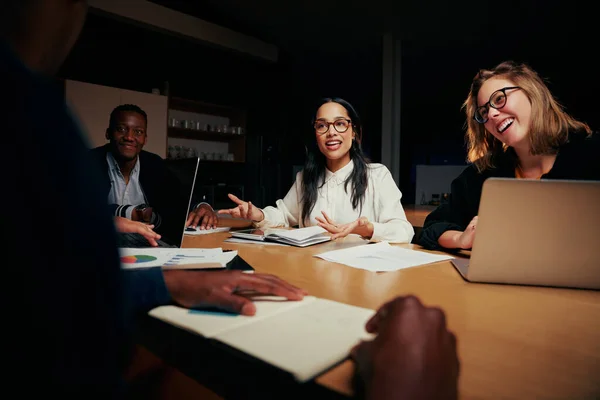 Happy diverse group of businesspeople sitting at table working together in office — ストック写真