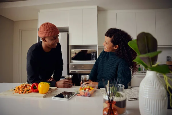 African American couple drinking coffee. Mixed race couple looking at each other in the kitchen at home. High quality photo — Stock Photo, Image