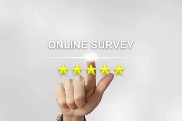 Business hand pushing online survey on screen — Stock Photo, Image