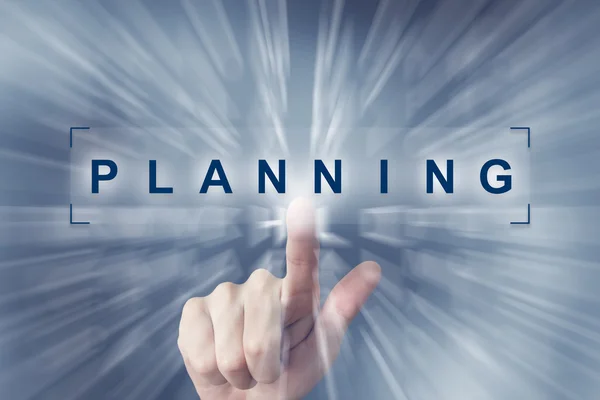 Hand clicking on planning button — Stock Photo, Image