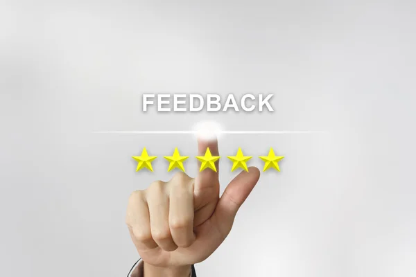 Business Hand drückt Feedback auf den Bildschirm — Stockfoto