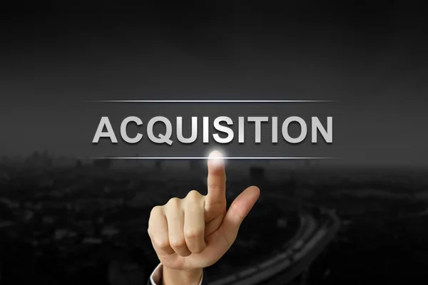 Business hand pushing acquisition button — Stock Photo, Image