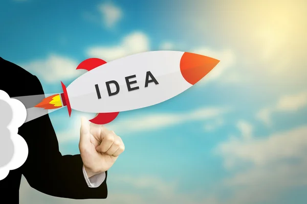 Business hand clicking idea rocket — Stock Photo, Image