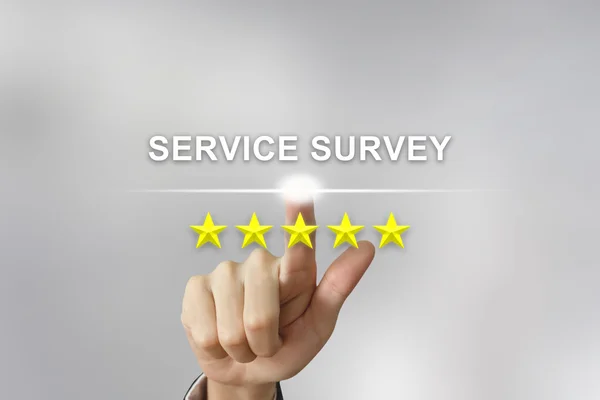 Business hand pushing service survey on screen — Stock Photo, Image