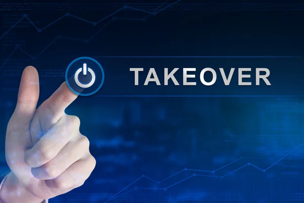 Business hand clicking takeover button — Stock Photo, Image