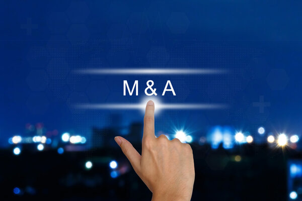 hand pushing M&A or Merger and Acquisition button on touch scree