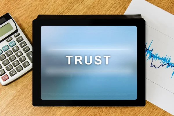 Trust word on digital tablet — Stock Photo, Image