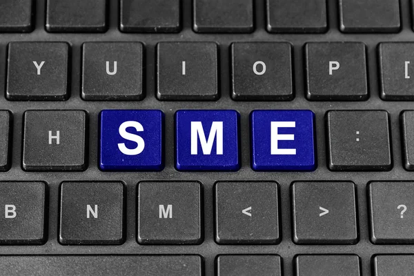 SME or Small and medium-sized enterprises word on keyboard — Stock Photo, Image