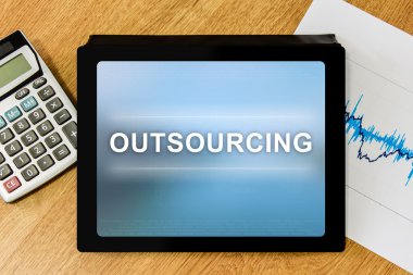 Outsourcing word on digital tablet clipart