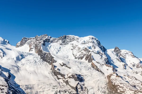 Snow Mountain Range krajina v regionu Alpy, Švýcarsko — Stock fotografie