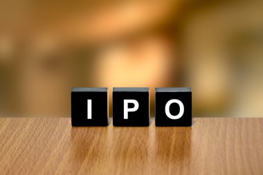 IPO or Initial public offering on black block clipart