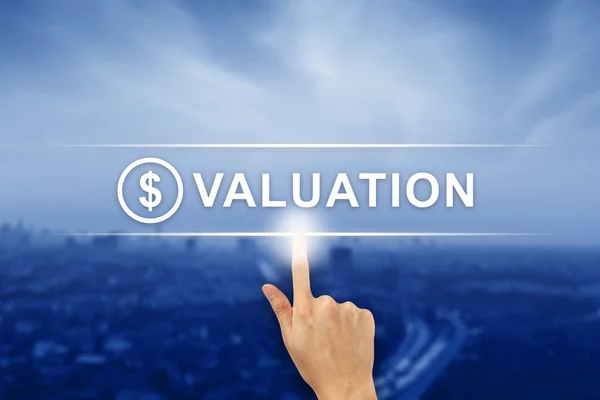 Hand clicking financial valuation button on touch screen — Stock Photo, Image