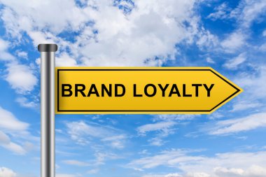 yellow road sign with brand loyalty words
