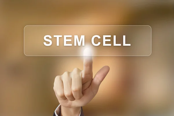 Business hand clicking stem cell button on blurred background — Stock fotografie