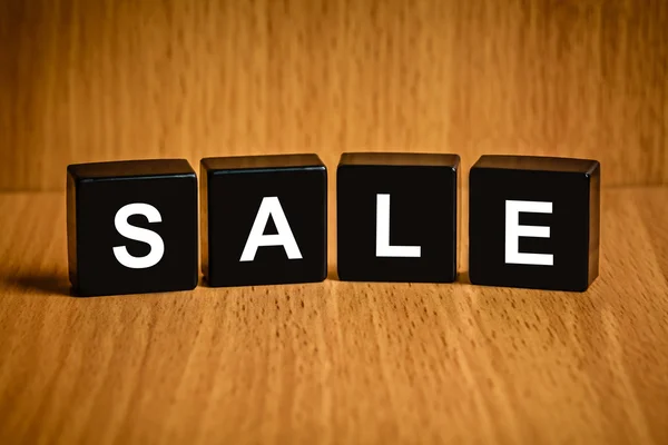 Sale word on black block — Stock Photo, Image