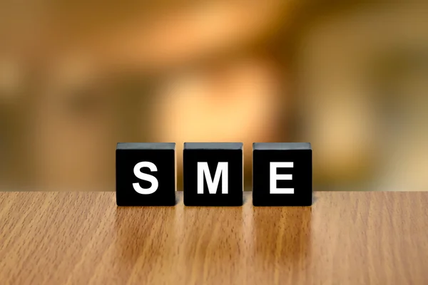 SME or Small and medium-sized enterprises on black block — Stock Photo, Image