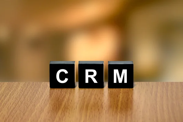 CRM or Customer relationship management on black block — Stock Photo, Image