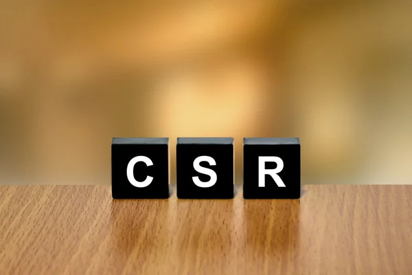 CSR of Corporate sociale verantwoordelijkheid op zwart blok — Stockfoto