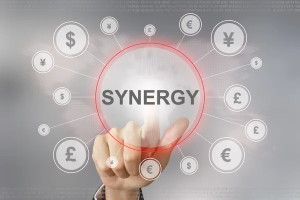 Business hand pushing synergy button — Stock Photo, Image