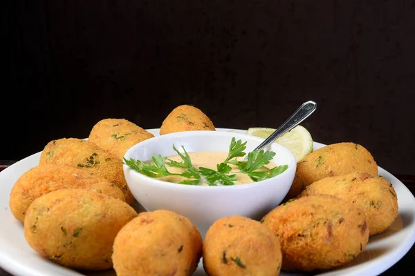 Delicious Fried Cod Dumpling Herb Sauce Table Blurred Dark Background — Stock Photo, Image