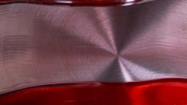 Close-up shot of a red glaze on a steel pan. Divide a caramel glaze with a white silicone spatula — Stock Video