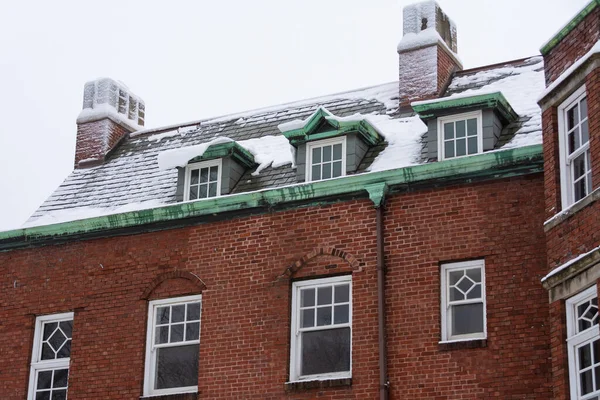 Old mansion in the Midwest after a Winter snow.  LaSalle, Illinois, USA