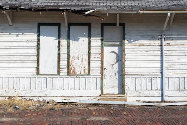 Exterior wall of old abandoned train station in the Midwest.