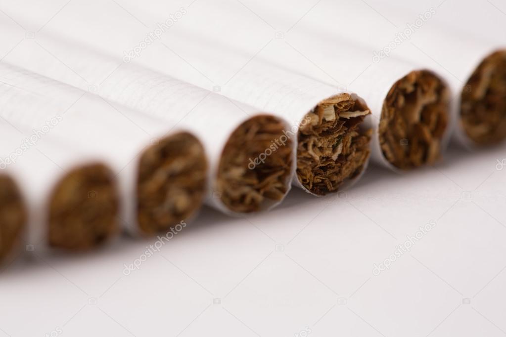 Row of cigarettes with tobacco texture