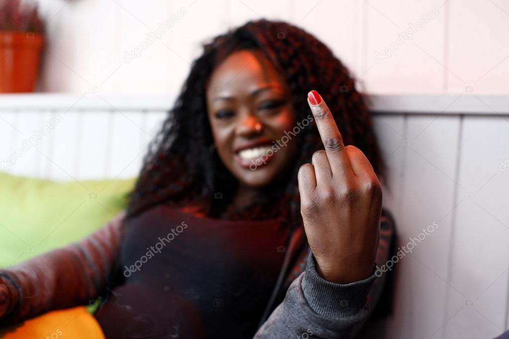 Young woman making a rude gesture