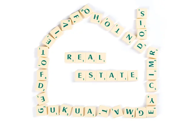 Scrabble Carta Azulejos para el concepto de bienes raíces Fotos de stock libres de derechos