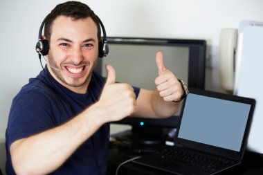 Happy call centre worker giving a thumbs up