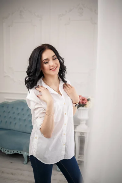 business portrait of a young female businessman. Dressed in a white shirt. Business style concept