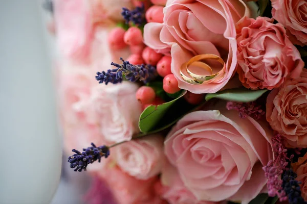 Golden wedding rings for newlyweds on their wedding day