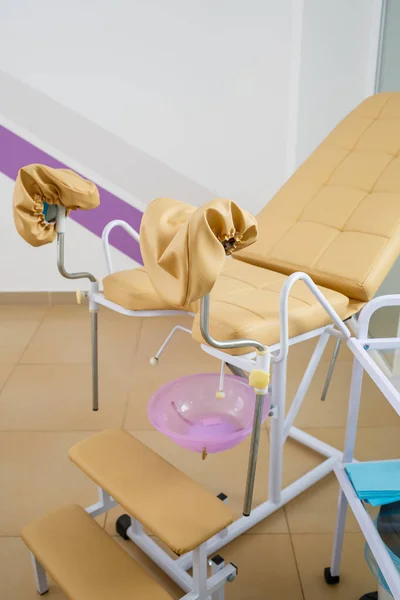 Modern gynecological examination chair for women. Medical chair in the gynecologist's office