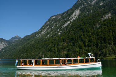 Boat on lake nearby Schonau am Konigssee, Germany clipart