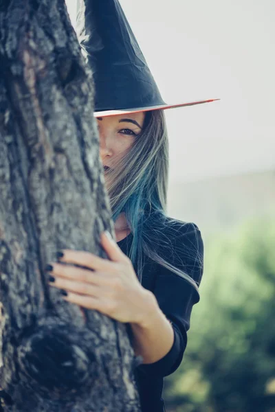 Young witch walking outdoor — Stock Photo, Image