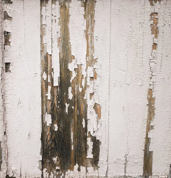 Målade i vit färg trä plankor med sprickor. — Stockfoto