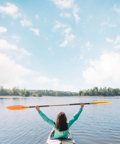 Young woman travels on the river. View from the back. — Stock Photo, Image