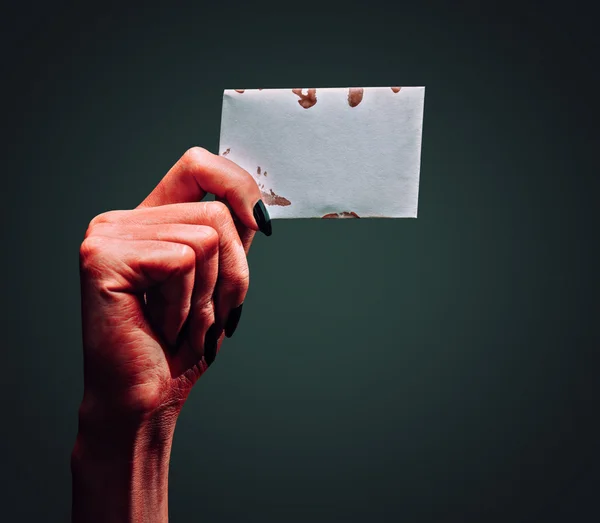 Demon hand with blank card — Stock Photo, Image