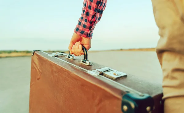 Female hand with suitcase handle — Stock Photo, Image