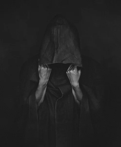 Human in coat with a hood, monochrome image — Stock Photo, Image