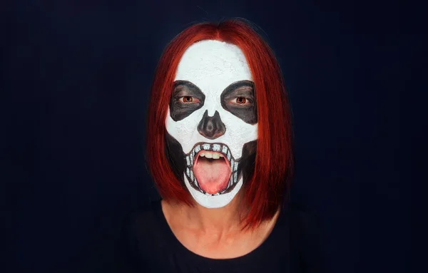 Skull woman showing tongue — Stock Photo, Image