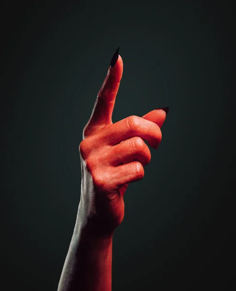 Demon hand with gesture pointing upward — Stock Photo, Image