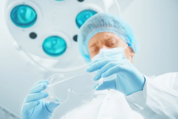 Surgeon doctor with protective glasses — Stock Photo, Image