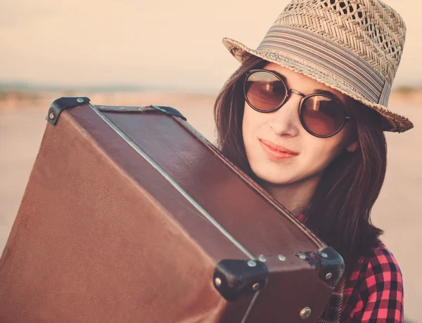 Hipster girl traveler with suitcase — Stock Photo, Image