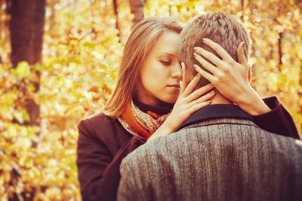 Blonde woman embraces man — Stock Photo, Image