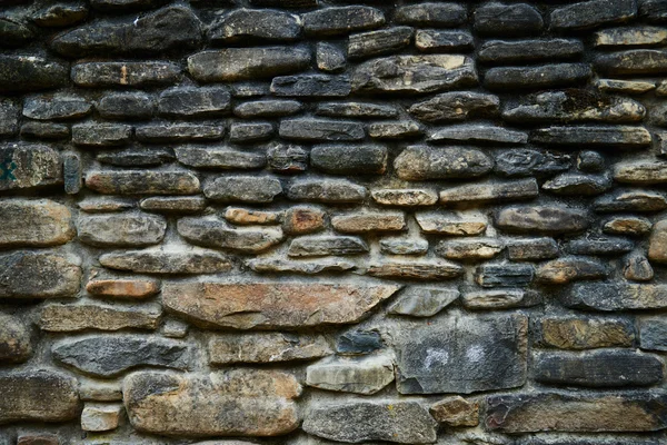 Parede de pedra escura — Fotografia de Stock