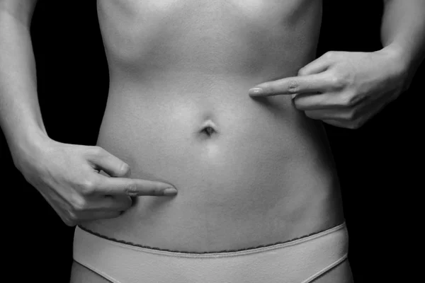 Woman points to the abdomen — Stock Photo, Image