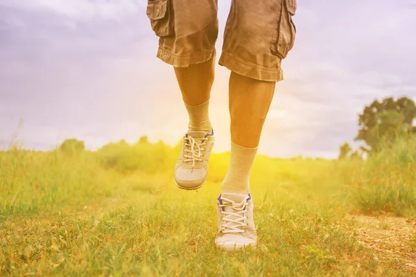 Man running on footpath — Stock Photo, Image