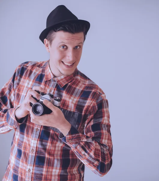 Happy young man with photo camera — ストック写真